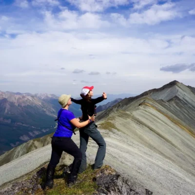 Students pay homage to the majesty of a peak they've climbed in the Talkeetna Mountains.