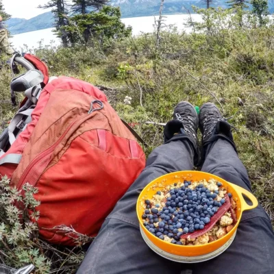 Enjoying a freshly picked addition to breakfast in the Chugach Mountain Range in Alaska.