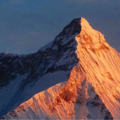 Snowy mountain peaks at sunrise in the Kumaon region of the Indian Himalaya.