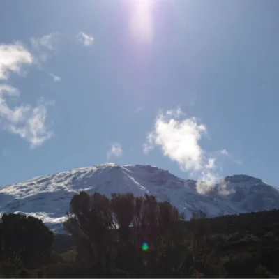 Looking up at the snowy slopes of Mount Kilimanjaro in Tanzania.