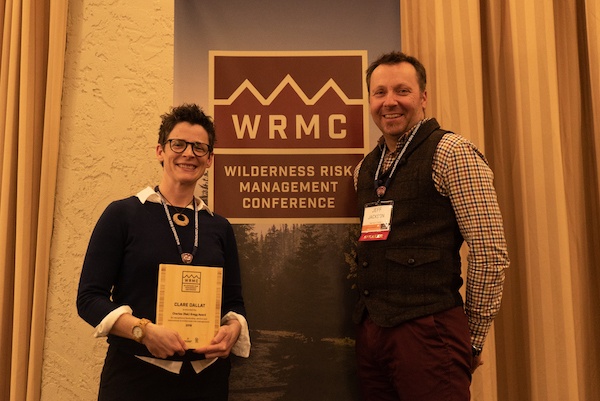 Clare Dallat holding Reb Gregg award with Jeff Jackson at 2018 Wilderness Risk Management Conference