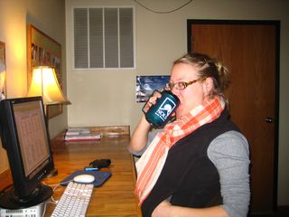 Whitney Enjoying a Warm Drink