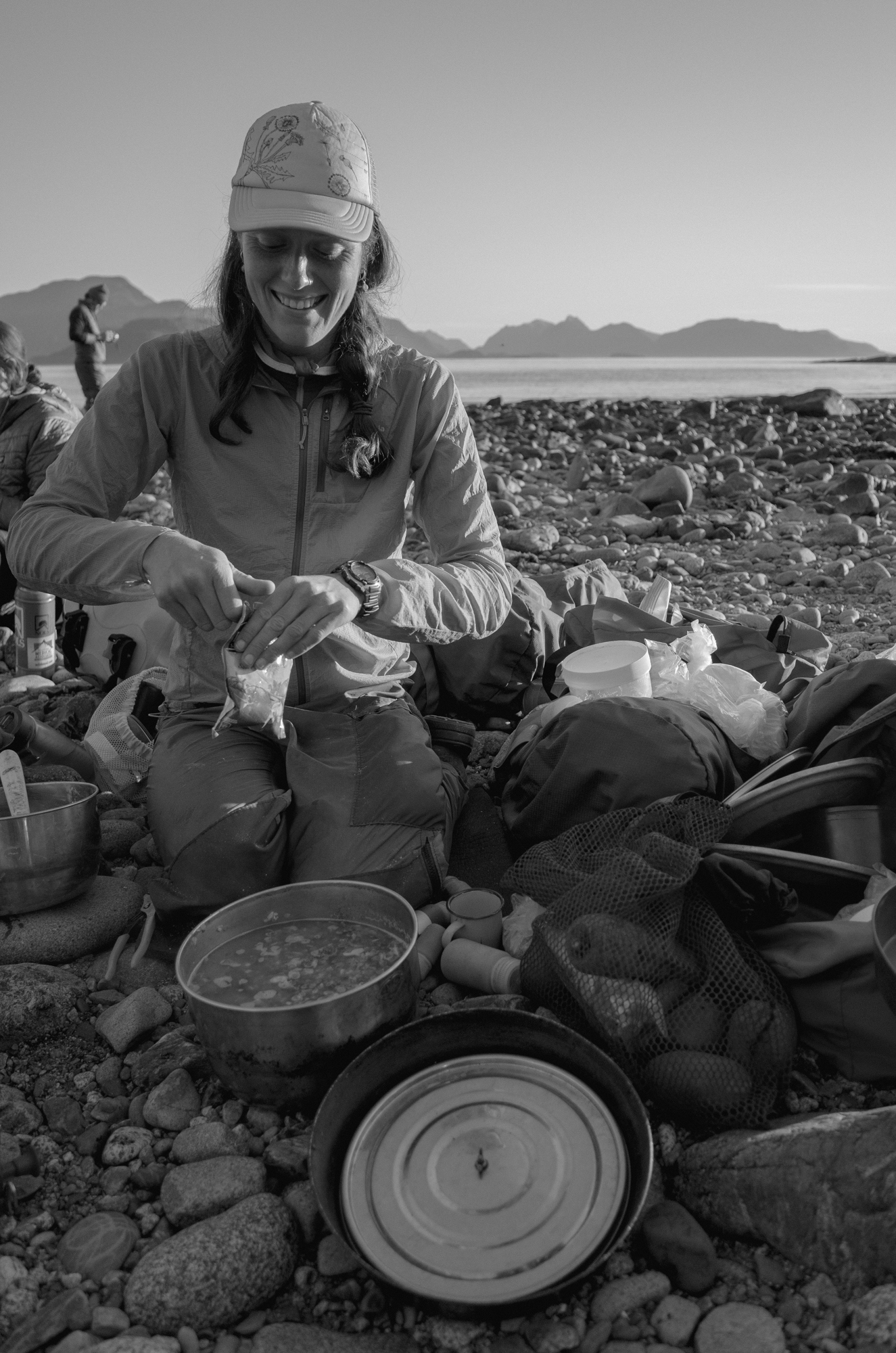 Person cooking on a camp stove