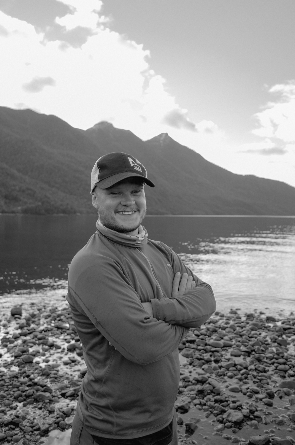 Person smiling in front of  ariver