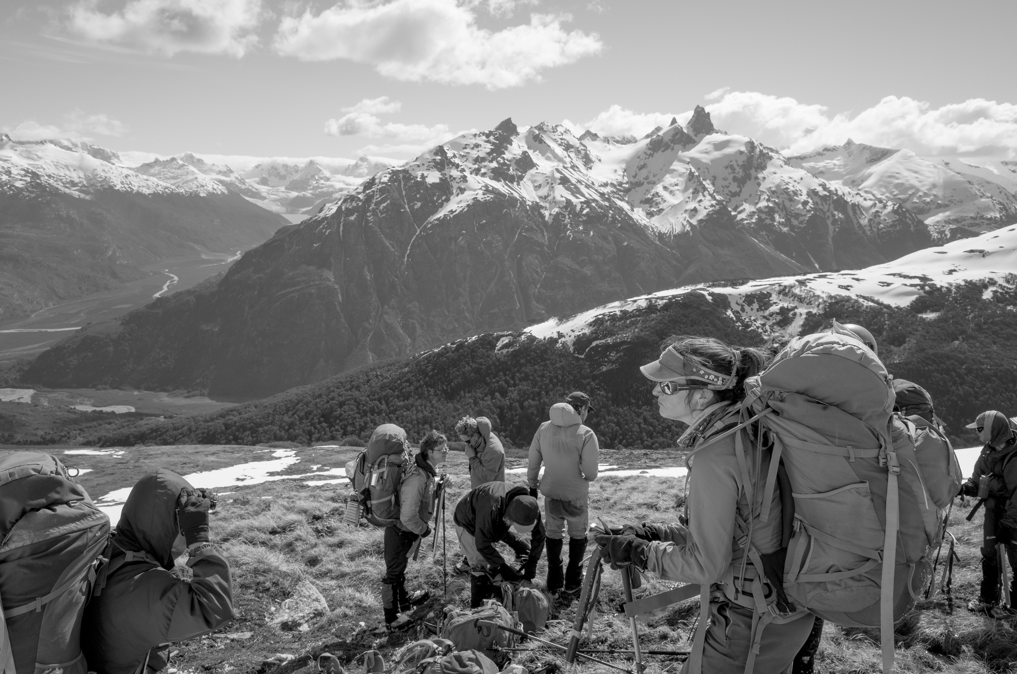 Backpackers with a stunning mountain peak in the background