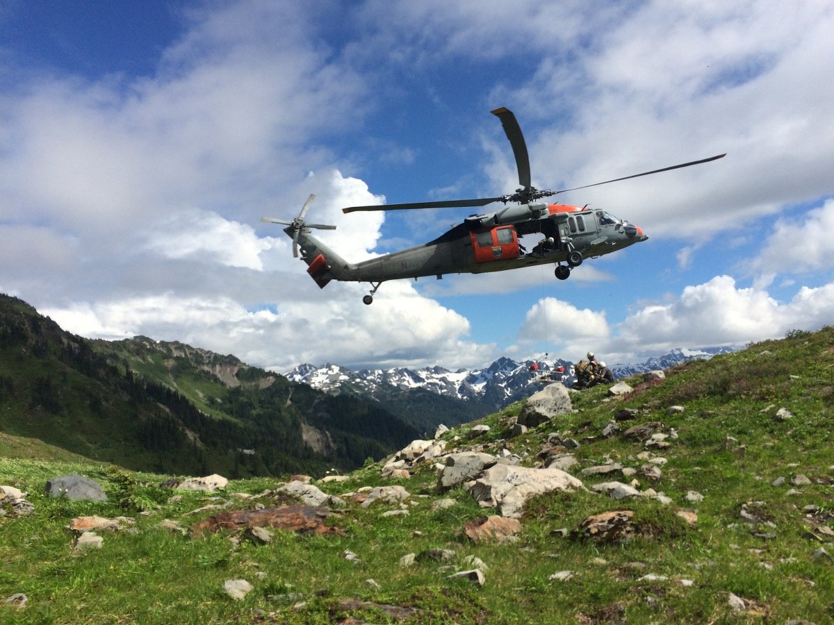 wilderness-medicine-helicopter-evacuation A rescue helicopter flies over a rocky mountain meadow