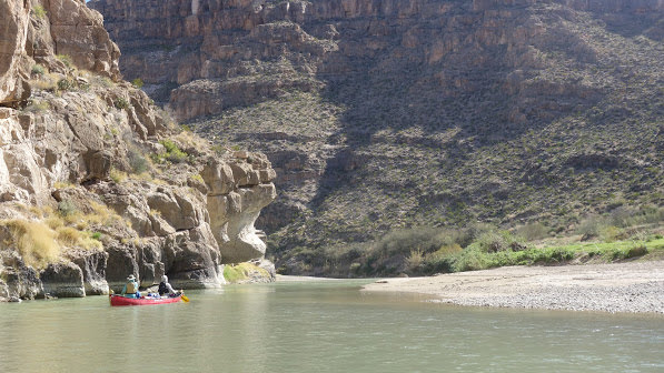 NOLS students paddle a canoe on the Rio Grande
