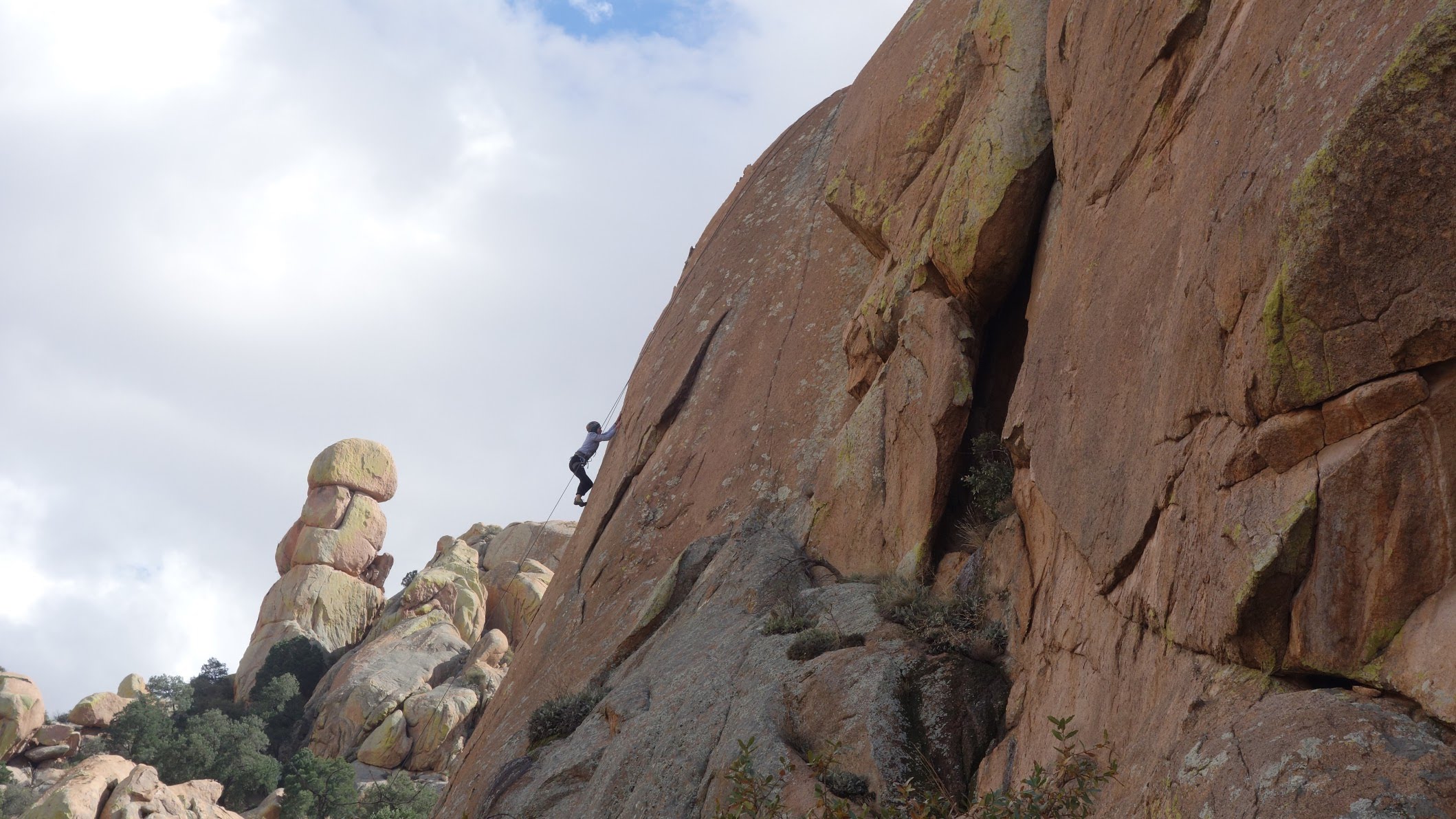 A person rock climbing at Cochise Stronghold
