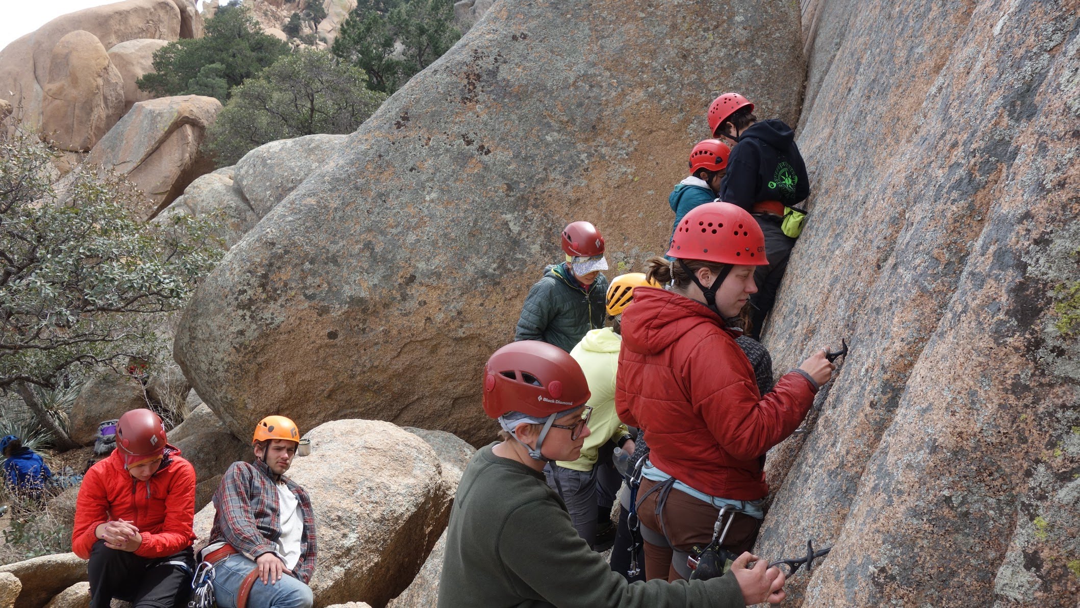 NOLS students practice placing rock climbing protection