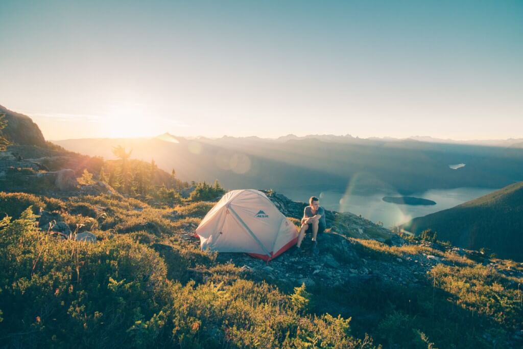Camping in a tent in the outdoors