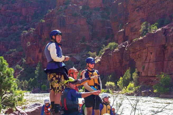 kirk_rasmussen_rmrb-2530.jpg__655x5000_q70_subject_location-2271,2271_subsampling-2 Students discussing route planning strategies for the whitewater ahead