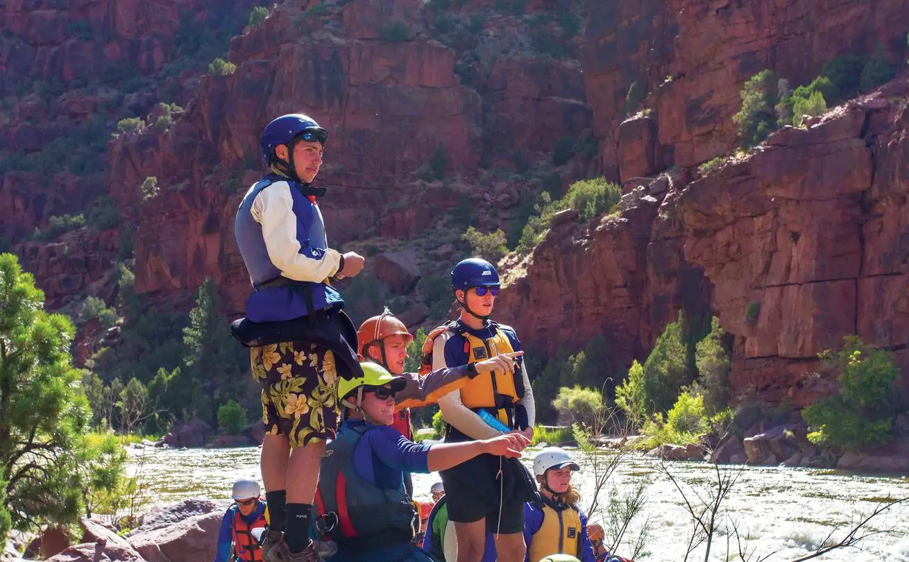 Students looking down river in a canyon