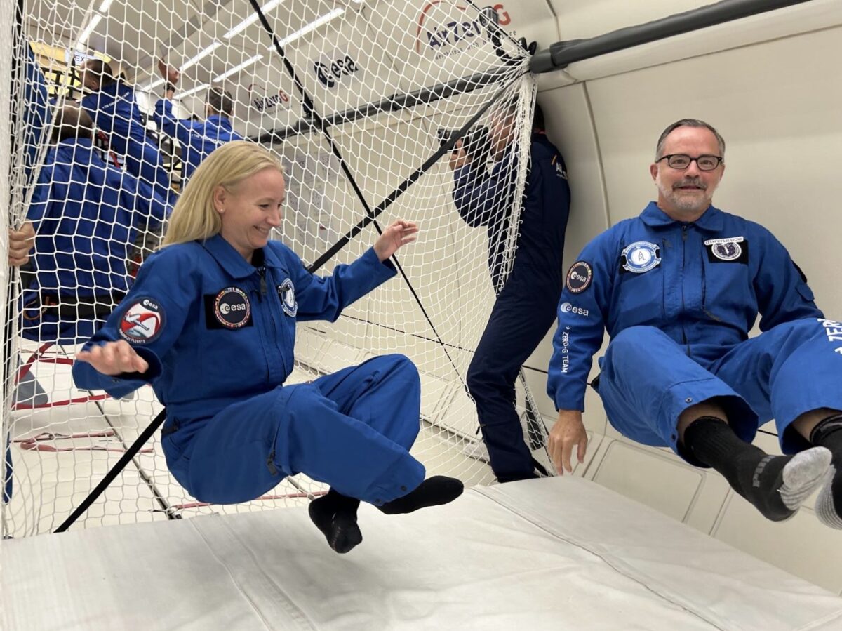Dr. Lonnie Petersen and Dr. Stuart Harris experience weightlessness on a parabolic flight.