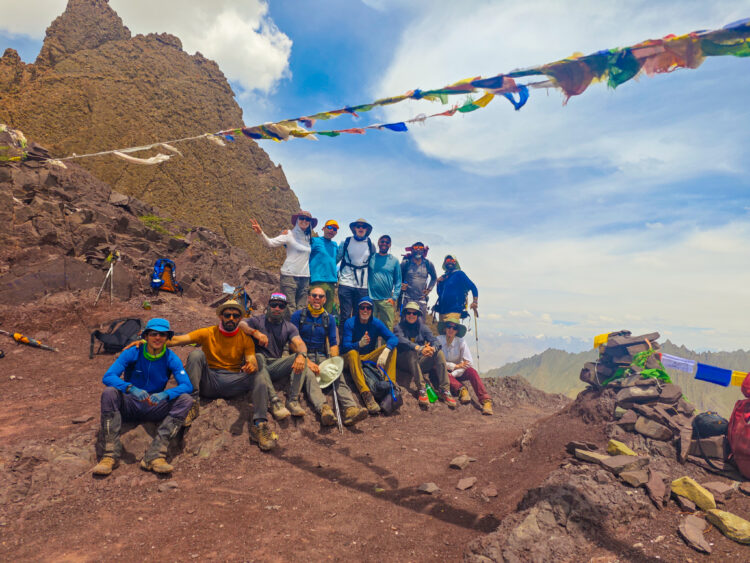 Group photo on pass with prayer flags