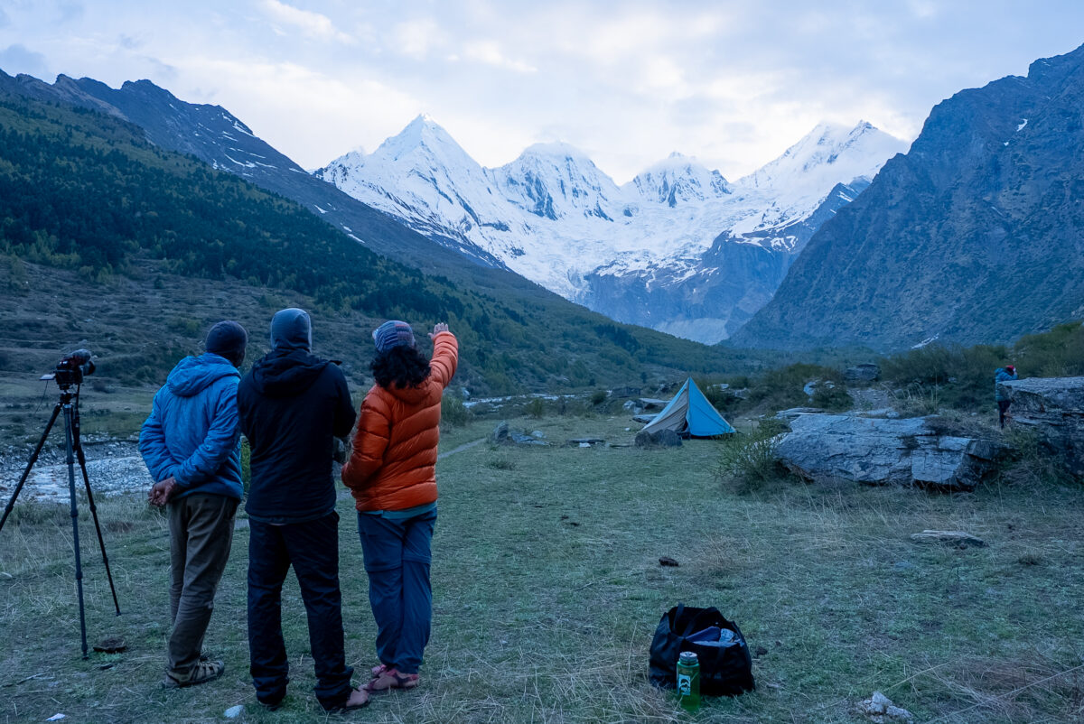 The team discussing potential route up the Meola glacier from Dugtu village.
