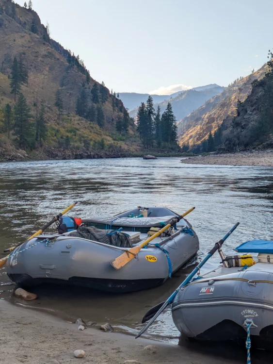 Boats anchor on the shore of the Salmon River
