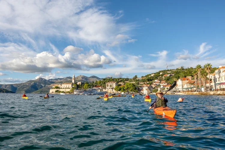 Sea kayakers paddle in the water in Croatia