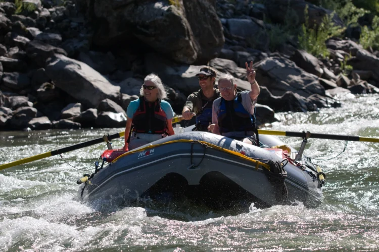 Rafters sit in the front of the boat on the Salmon River